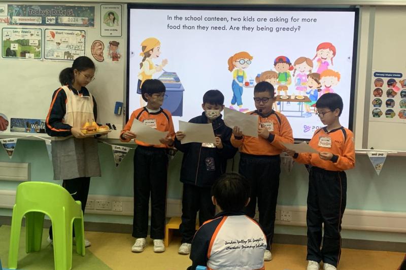 Students perform a drama.